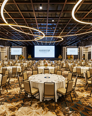brilliance ballroom with tables and screens